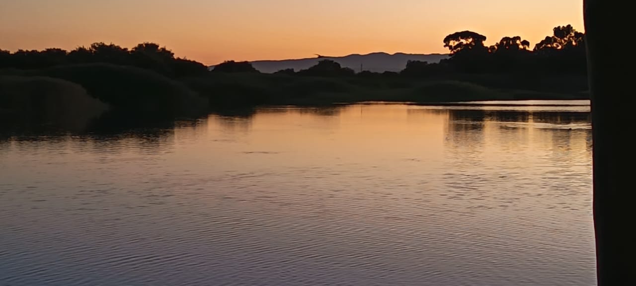 A peaceful river at sunset, photographed on Gerhardt’s travels.
